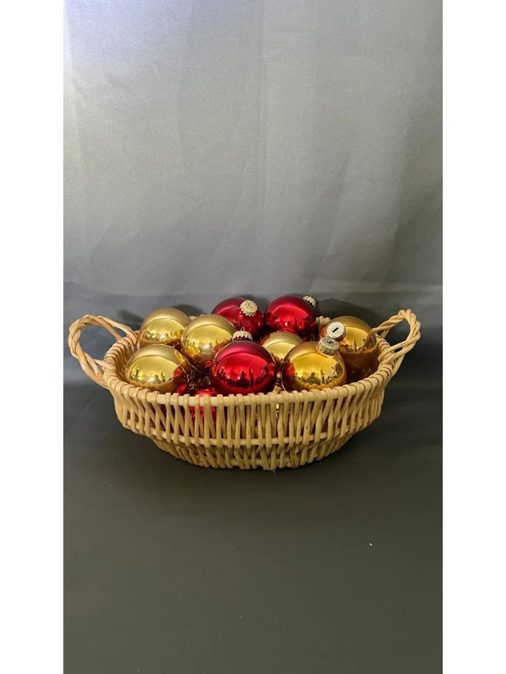 Shiny Red & Gold Christmas Ornaments In Wicker Basket